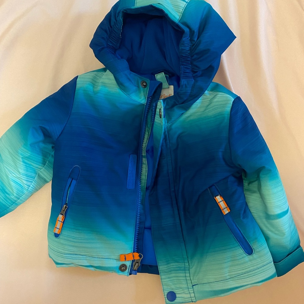 Blue puffy jacket.